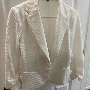 Cute ivory jacket for spring with slouch arms.  Closure.  Good condition.